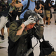 A policeman reacts after being attacked by protesters inside a mall in Sha Tin in Hong Kong, July 14, 2019.